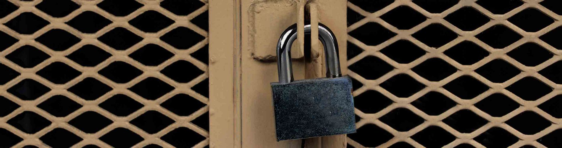 An image of a lock securing a beige-colored case that is made out of Expanded Metal.