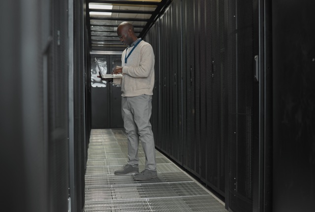 Ventilation through Bar Grating panels in a data center server room.