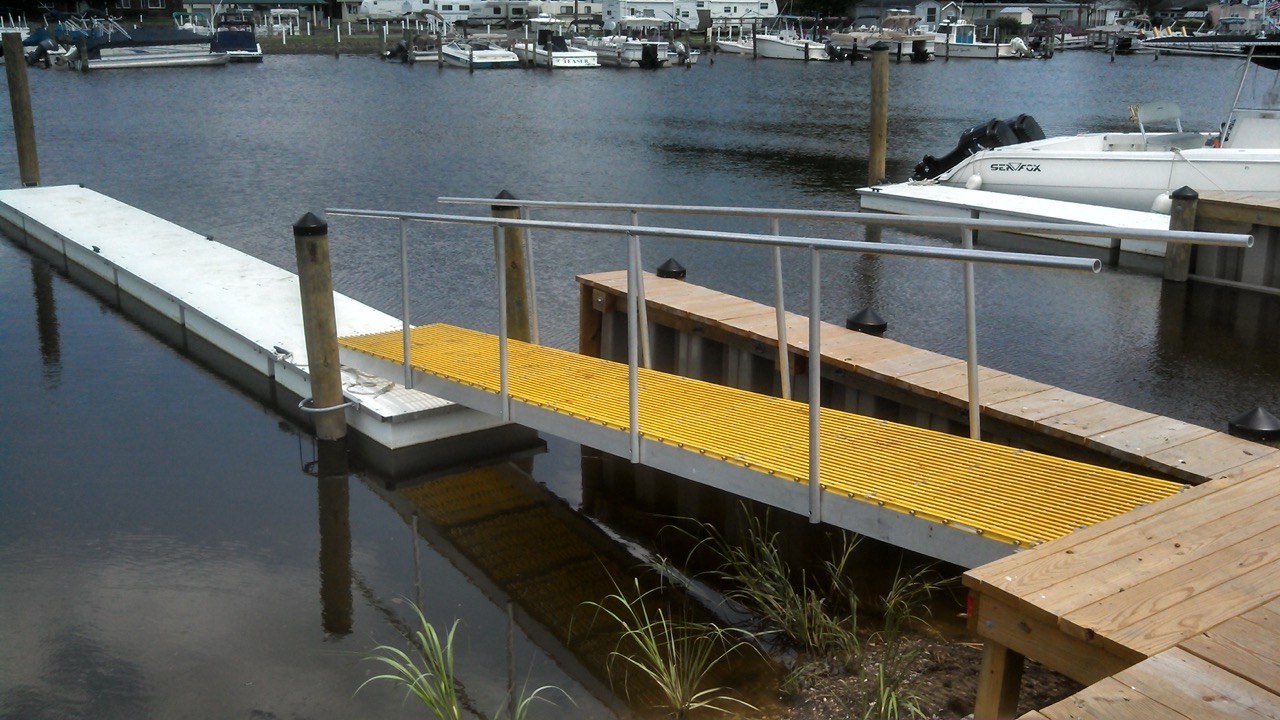 An image of a gangway made out of Fiberglass Grating that leads down to a floating dock.