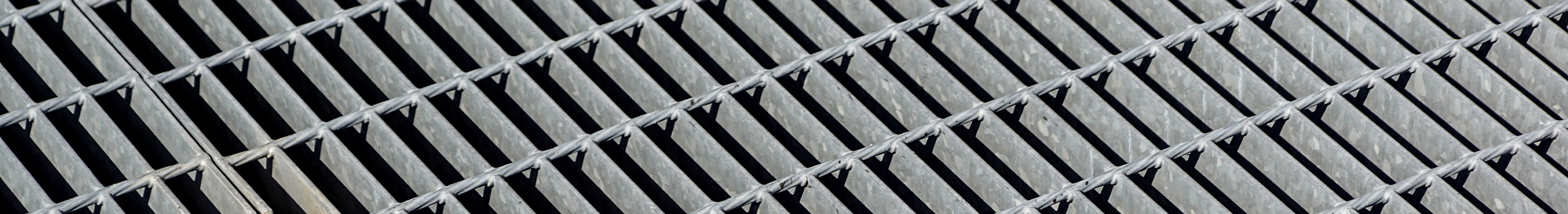 A close-up photo of Standard-Duty Welded Bar Grating used as a hero image.